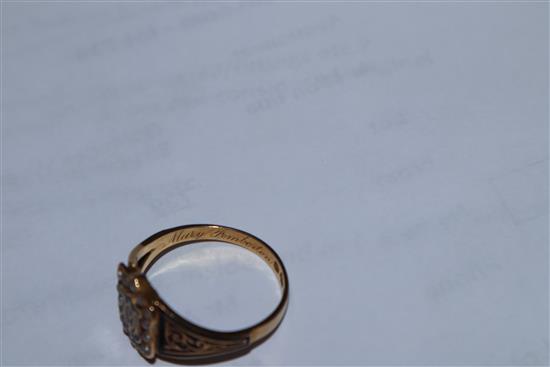 An early 19th century 18ct gold, black enamel and seed pearl set mourning ring,